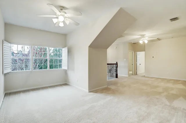 a view of a livingroom with a staircase