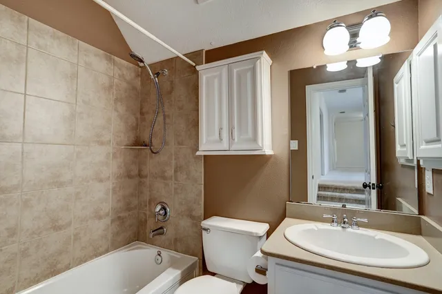 a bathroom with a sink vanity and a mirror