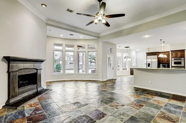 a large bathroom with a granite countertop sink a mirror and shower