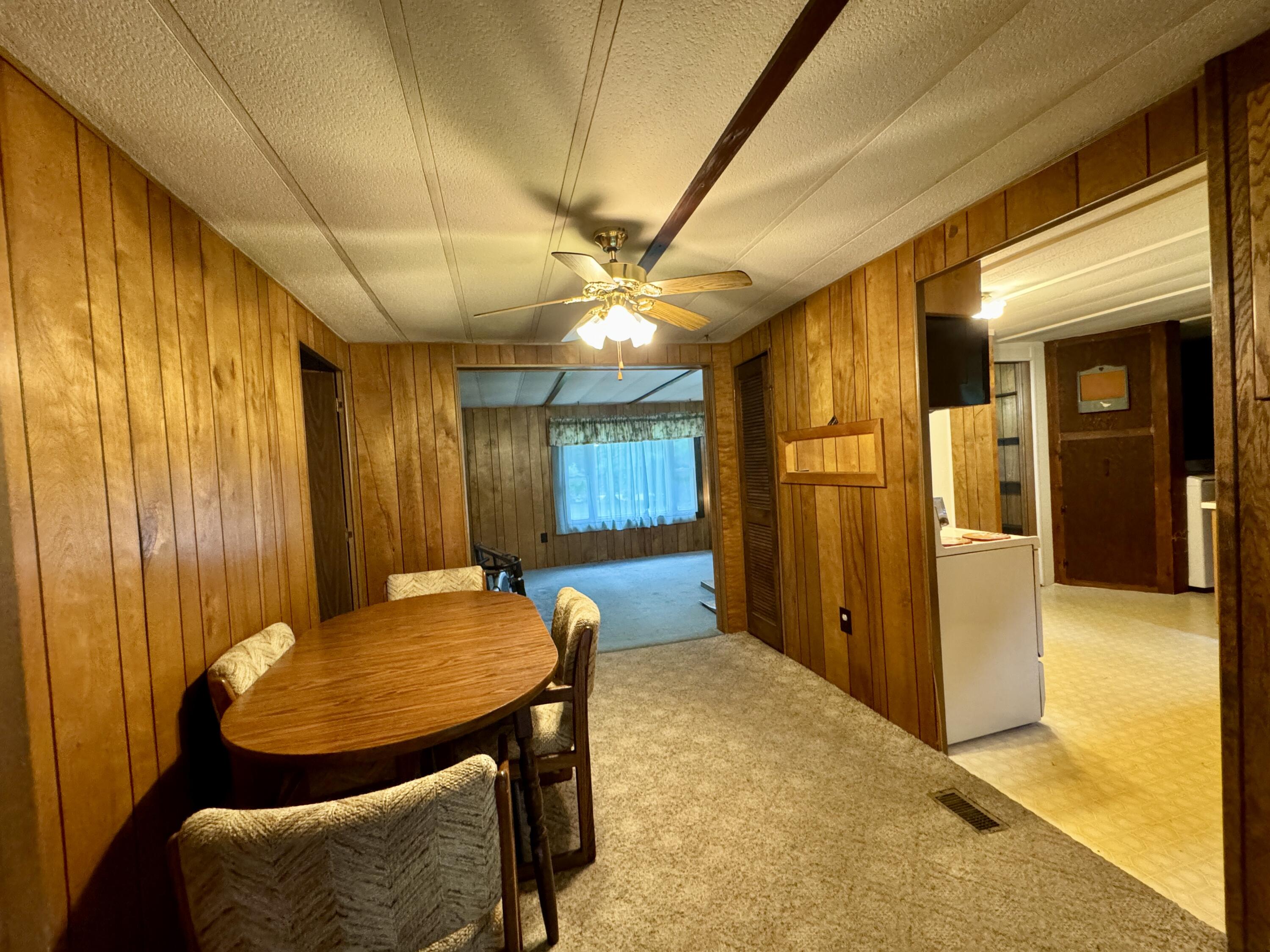 548 Main Road Charleston, ME 04422 - Photo 6 of 43 Dining to Kitchen and Living Room
