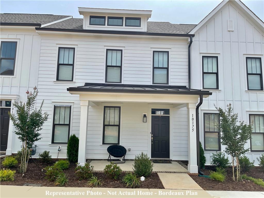 10175 Rainier Trail Drive Northwest Huntersville, NC 28078 - Photo 1 of 18 a front view of a house with garden