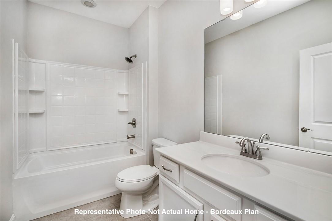 10175 Rainier Trail Drive Northwest Huntersville, NC 28078 - Photo 16 of 18 a bathroom with a sink toilet vanity and shower