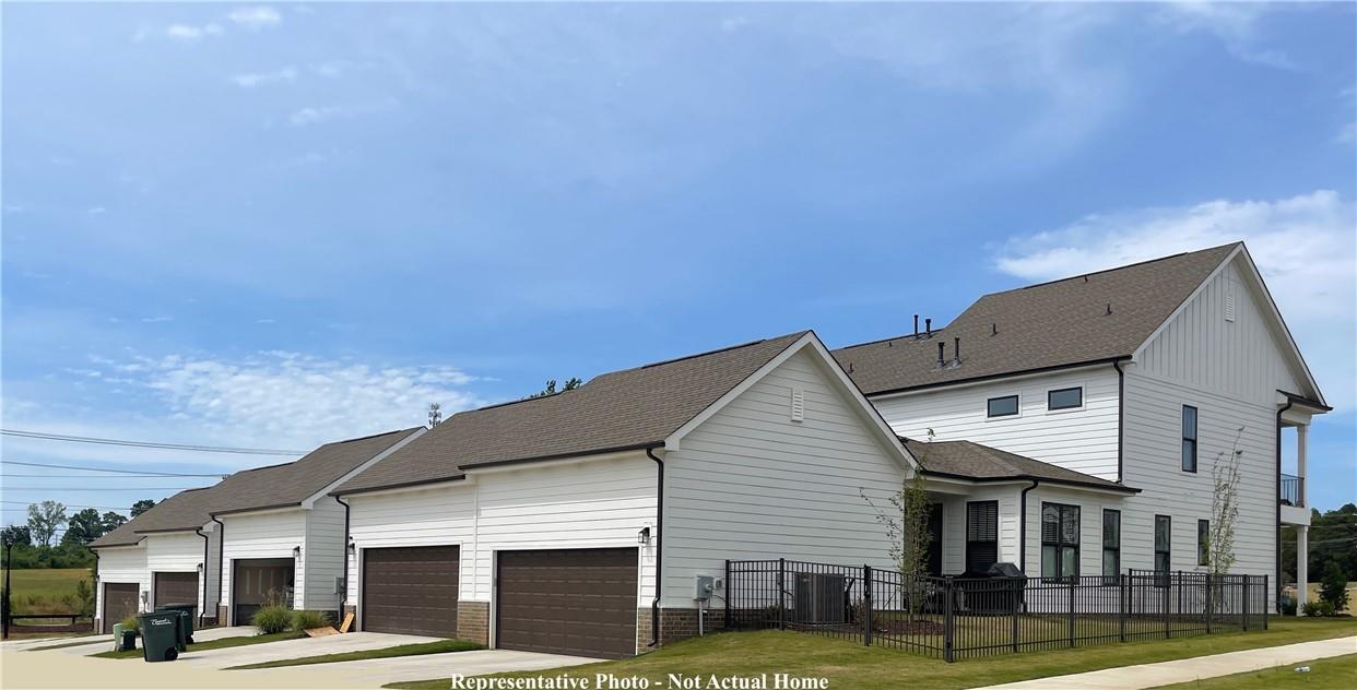 10175 Rainier Trail Drive Northwest Huntersville, NC 28078 - Photo 18 of 18 a front view of a building with a garden
