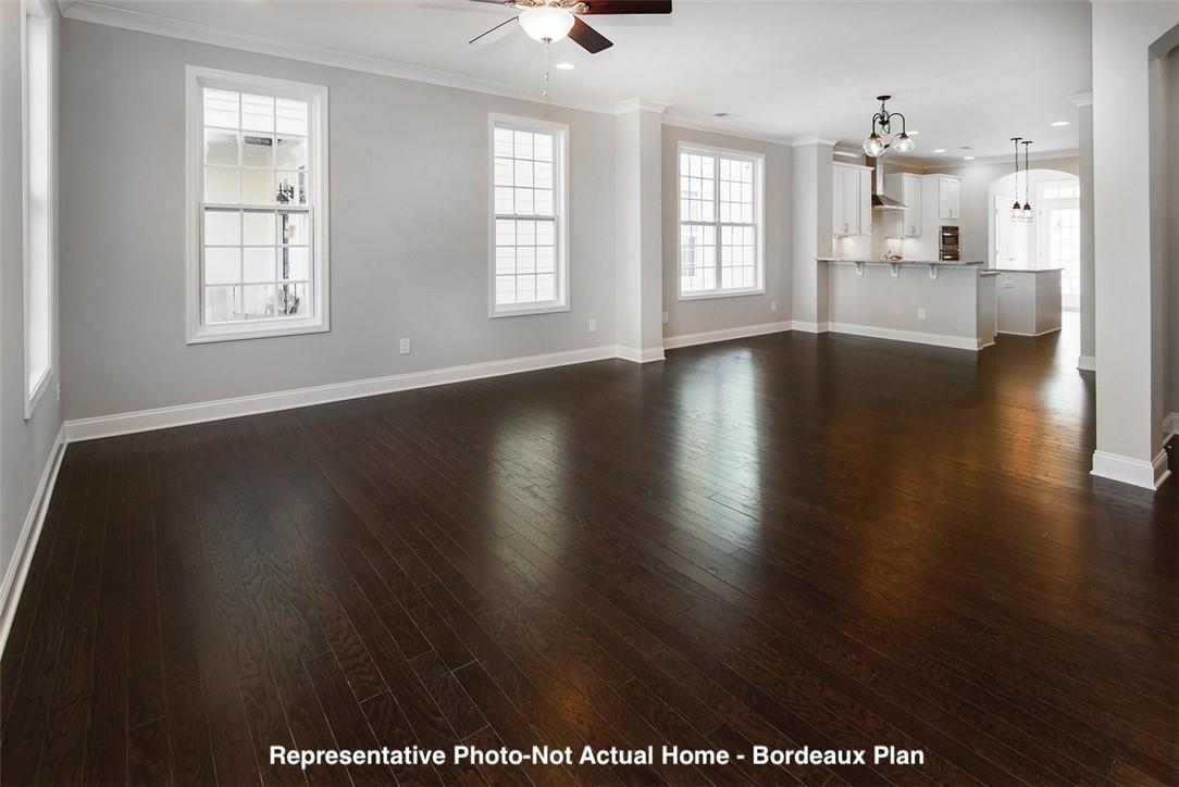 10175 Rainier Trail Drive Northwest Huntersville, NC 28078 - Photo 2 of 18 an empty room with wooden floor and windows