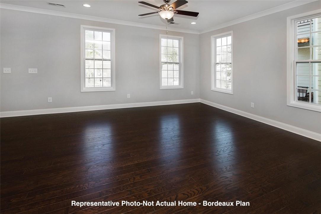 10175 Rainier Trail Drive Northwest Huntersville, NC 28078 - Photo 4 of 18 an empty room with wooden floor and windows