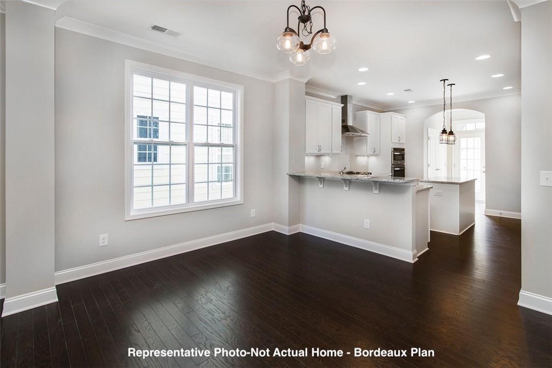 10175 Rainier Trail Drive Northwest Huntersville, NC 28078 - Photo 5 of 18 a view of kitchen with granite countertop window and wooden floor