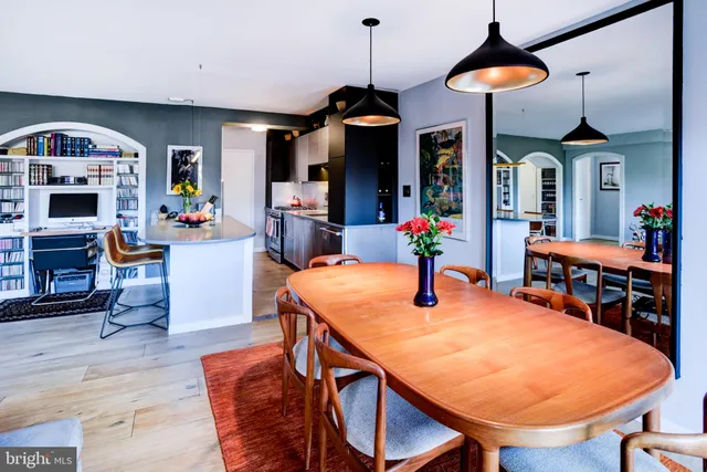a kitchen with stainless steel appliances granite countertop a sink and a refrigerator
