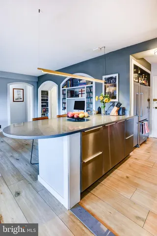 a kitchen with stainless steel appliances a sink and a microwave