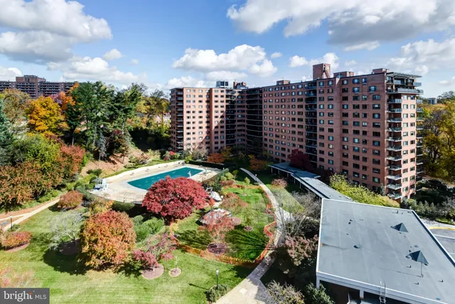 a room with furniture and a floor to ceiling window