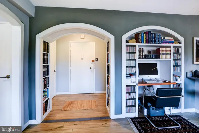 a living room with furniture a rug and a fireplace