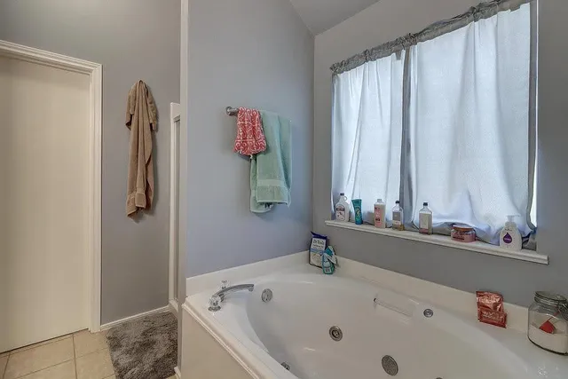 a bathroom with a tub and sink