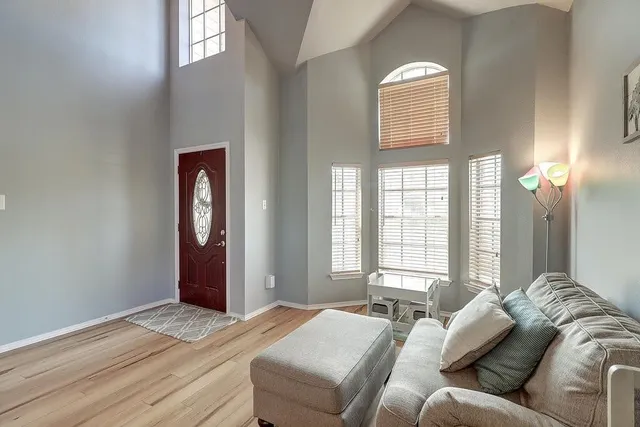 a bed sitting in a bedroom next to a window