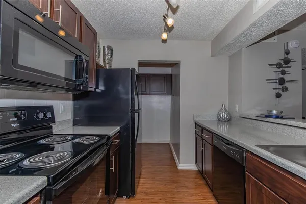 a kitchen with a stove and a microwave