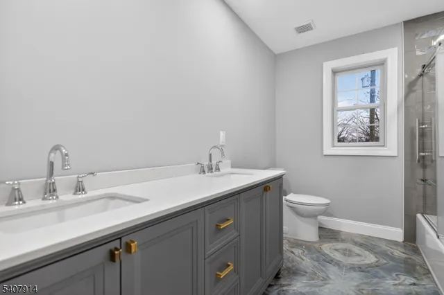 a bathroom with a sink and a toilet