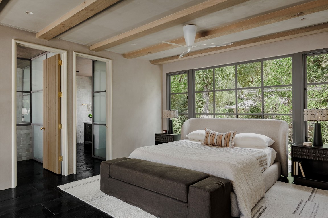 2600 Tanglewood Trail Austin, TX 78703 - Photo 18 of 35 a bedroom with a large bed and a large window