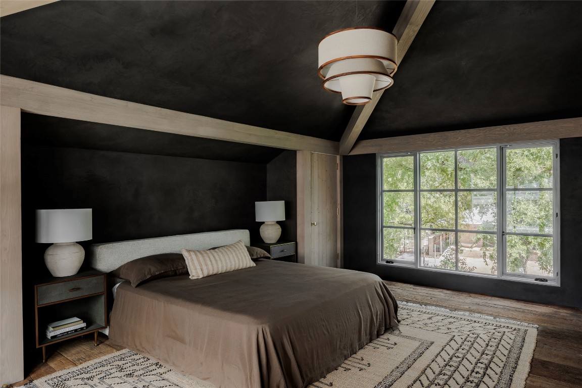 2600 Tanglewood Trail Austin, TX 78703 - Photo 22 of 35 a bedroom with a bed and window