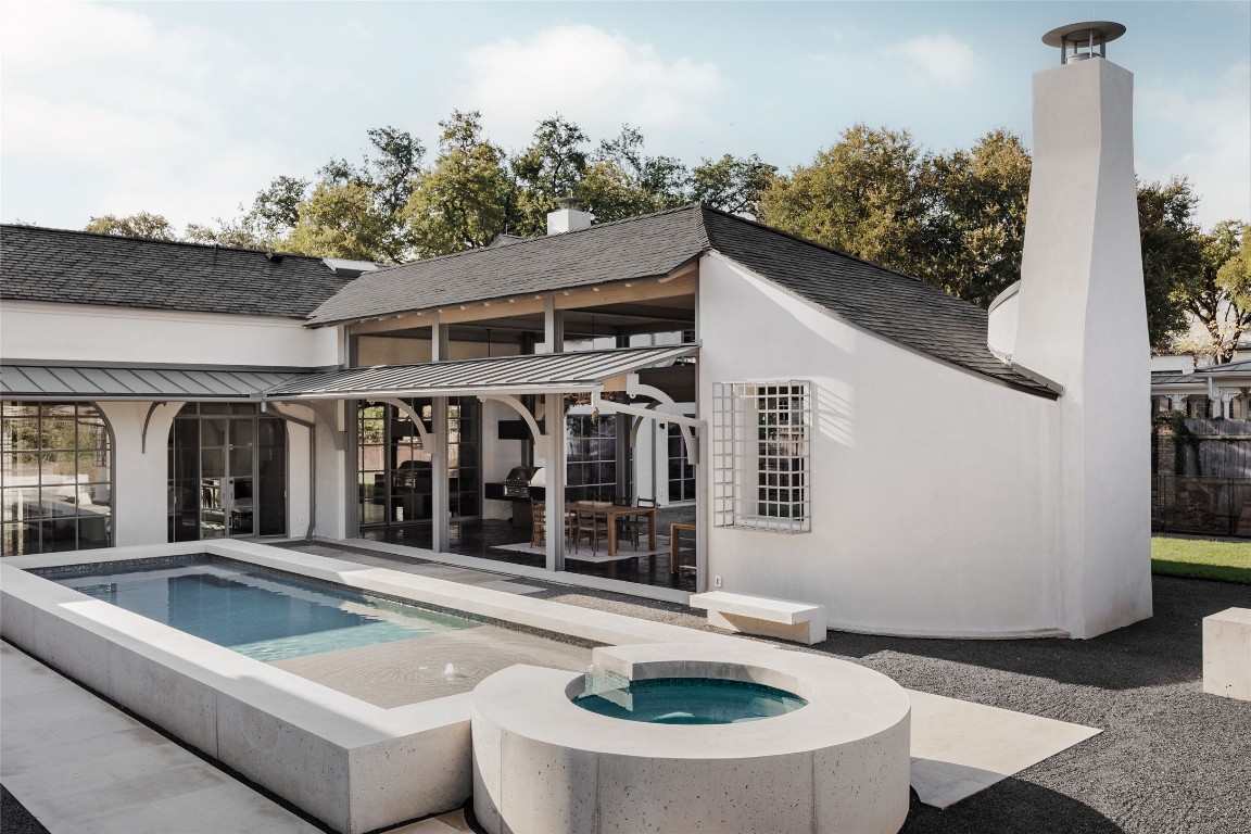 2600 Tanglewood Trail Austin, TX 78703 - Photo 29 of 35 a view of a house with swimming pool and porch