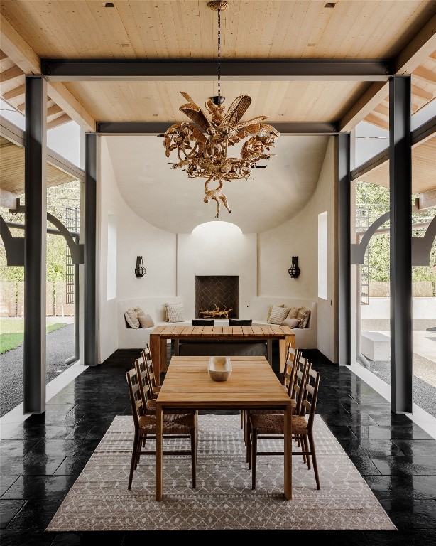 2600 Tanglewood Trail Austin, TX 78703 - Photo 33 of 35 a dining room with furniture a rug and a chandelier