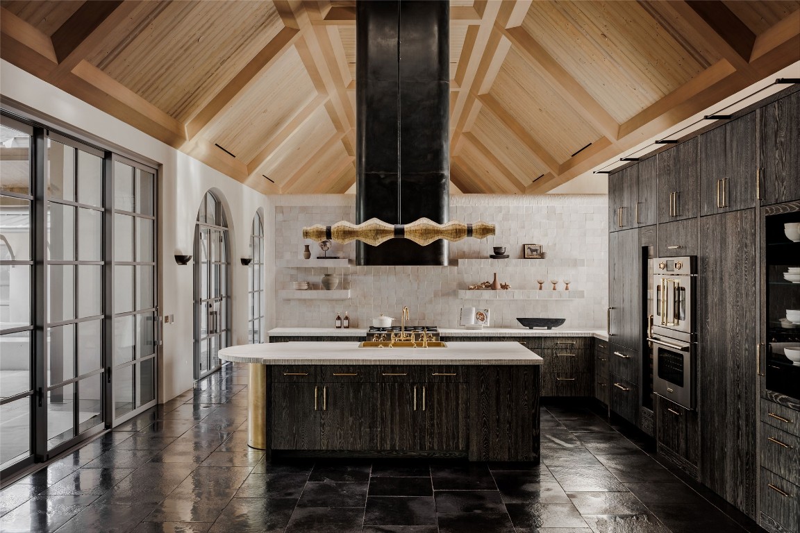 2600 Tanglewood Trail Austin, TX 78703 - Photo 9 of 35 a kitchen with stainless steel appliances a sink and a refrigerator
