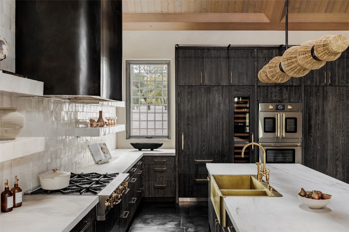2600 Tanglewood Trail Austin, TX 78703 - Photo 10 of 35 a kitchen with a stove and a table