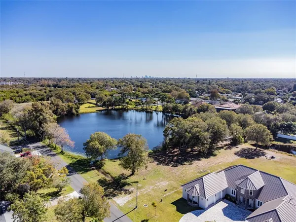 an aerial view of a house with a yard
