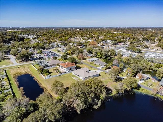 an aerial view of residential house with outdoor space