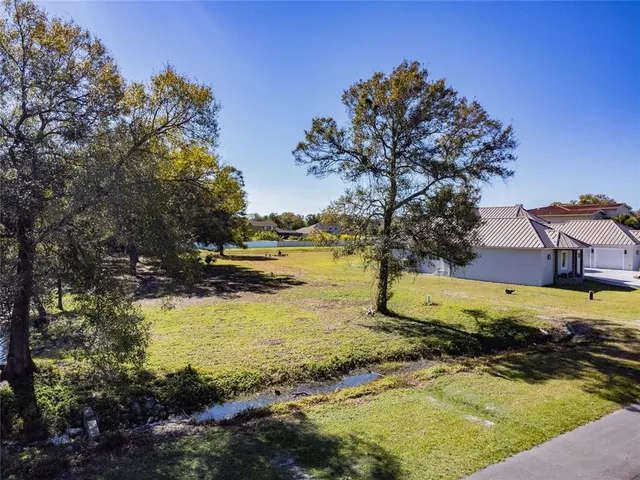 a view of a lake with a house in the background
