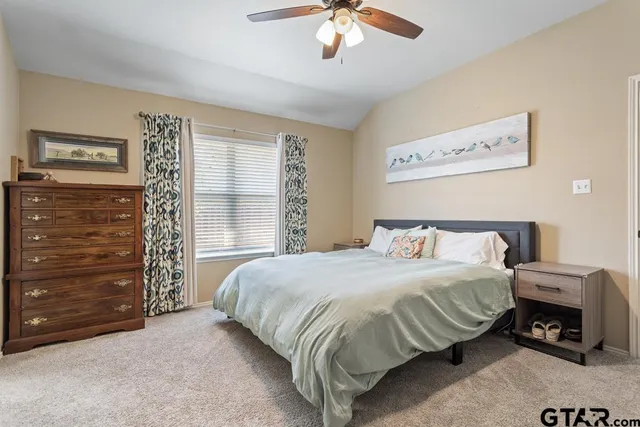 a bedroom with a bed and a cabinet