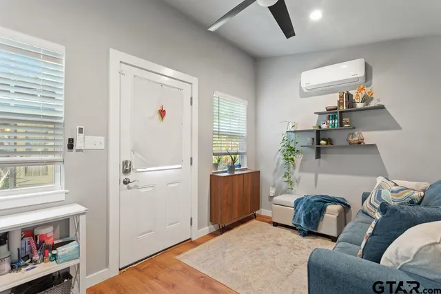 a bedroom with furniture and a window