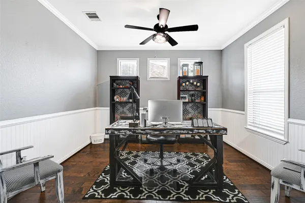 a living room with hard wood floors and a window