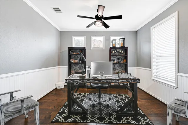 a living room with hard wood floors and a window