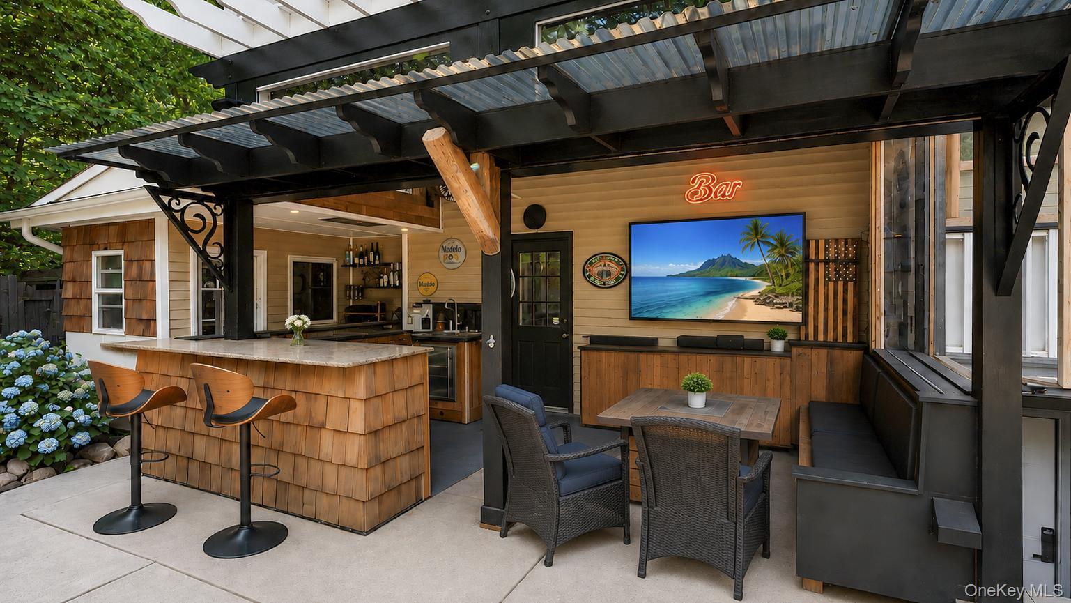 19 Joan Road Bay Shore, NY 11706 - Photo 46 of 50 Outdoor entertainment area featuring a corrugated metal roof, wood shake bar with a stone countertop, built-in media console with television, exterior wall-mounted lighting, and integrated bench seating