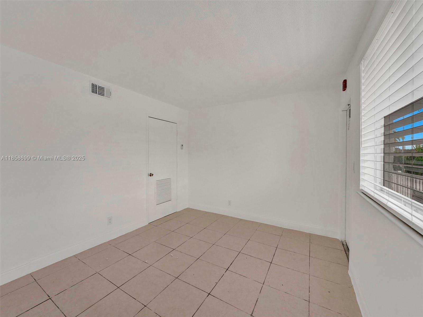 14190 West Dixie Highway, Unit 11 North Miami, FL 33161 - Photo 15 of 21 a view of an empty room