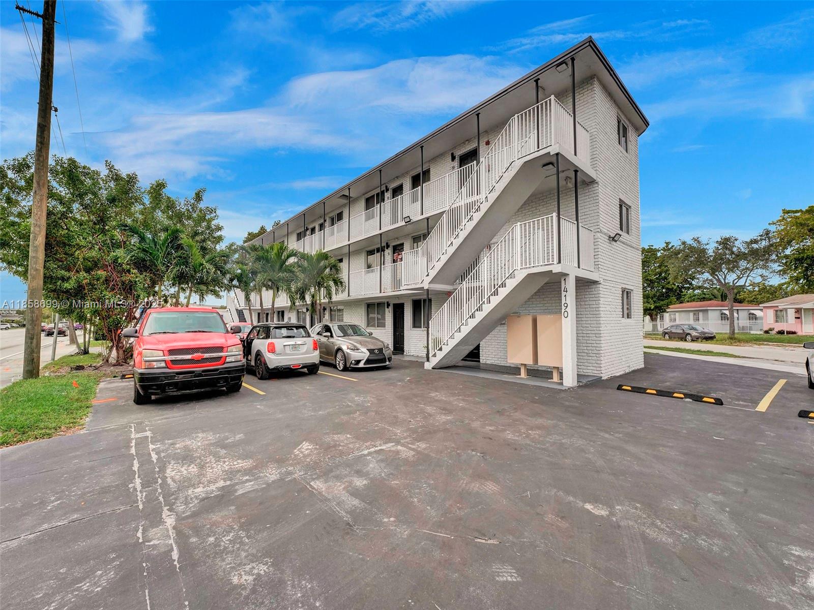 14190 West Dixie Highway, Unit 11 North Miami, FL 33161 - Photo 2 of 21 a car parked in front of a house