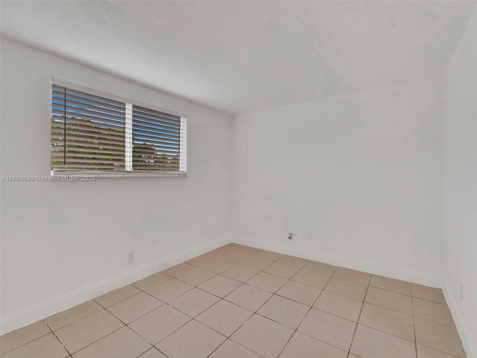 14190 West Dixie Highway, Unit 11 North Miami, FL 33161 - Photo 4 of 21 a view of empty room