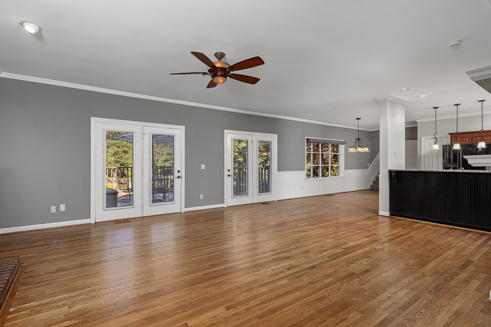 341 Sandcastle Road Franklin, TN 37069 - Photo 11 of 41 a view of an empty room with wooden floor and a window