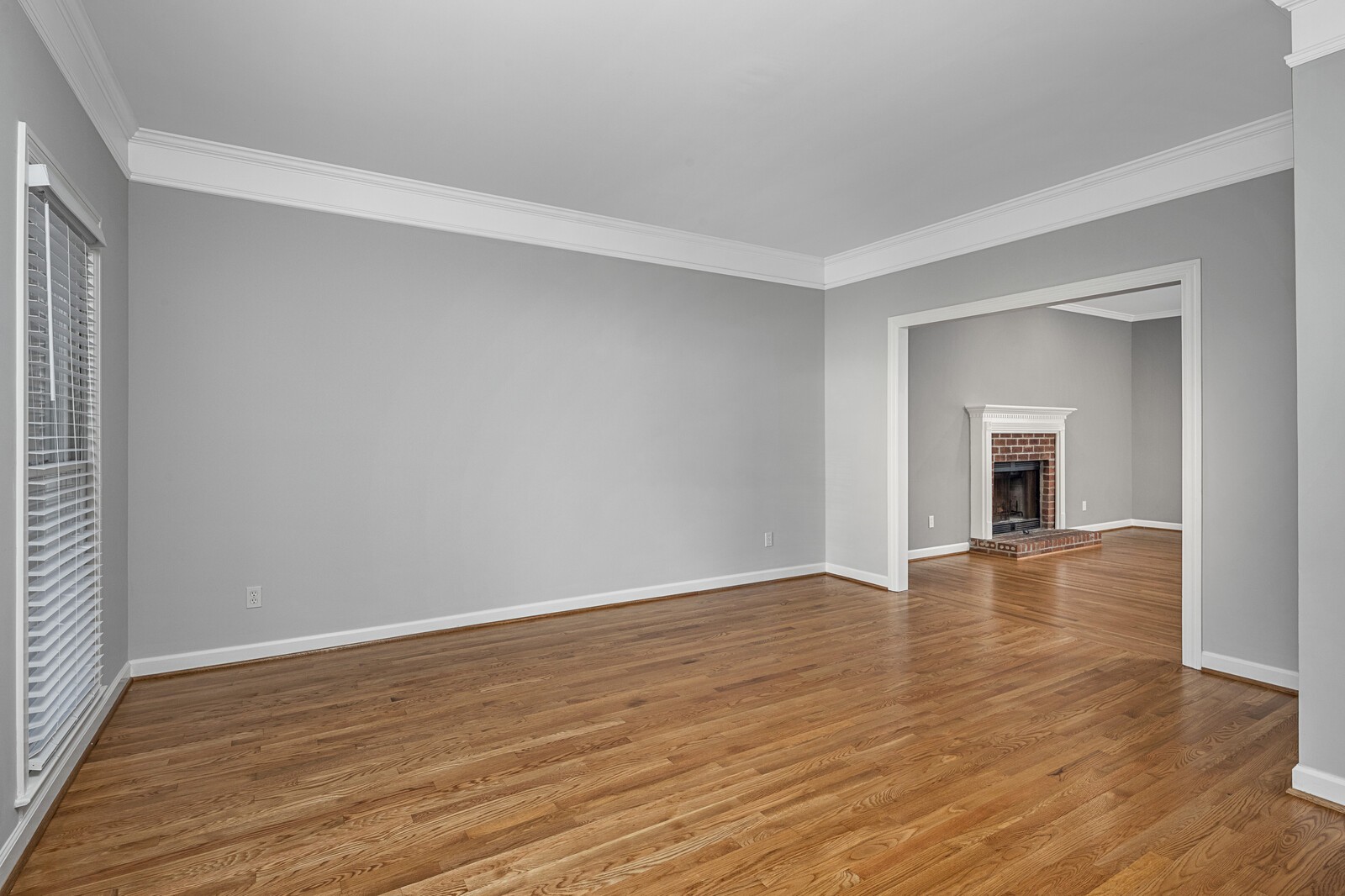 341 Sandcastle Road Franklin, TN 37069 - Photo 8 of 41 a view of an empty room with wooden floor and a window