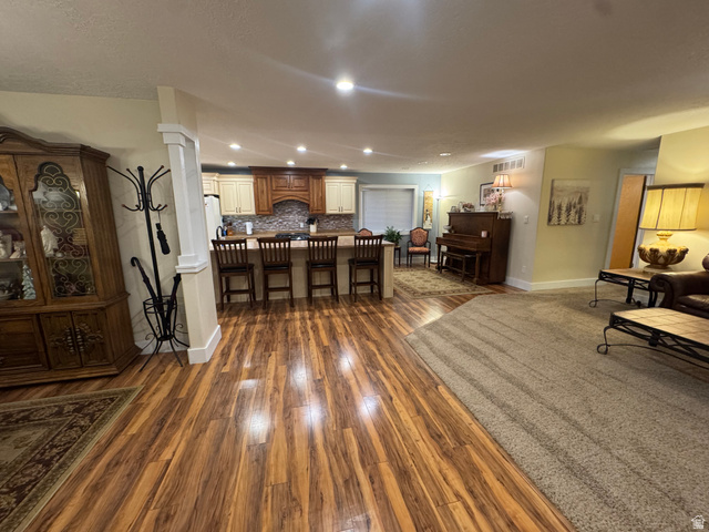 655 North 8th East Preston, ID 83263 - Photo 4 of 32 Living room with dark wood finished floors and recessed lighting