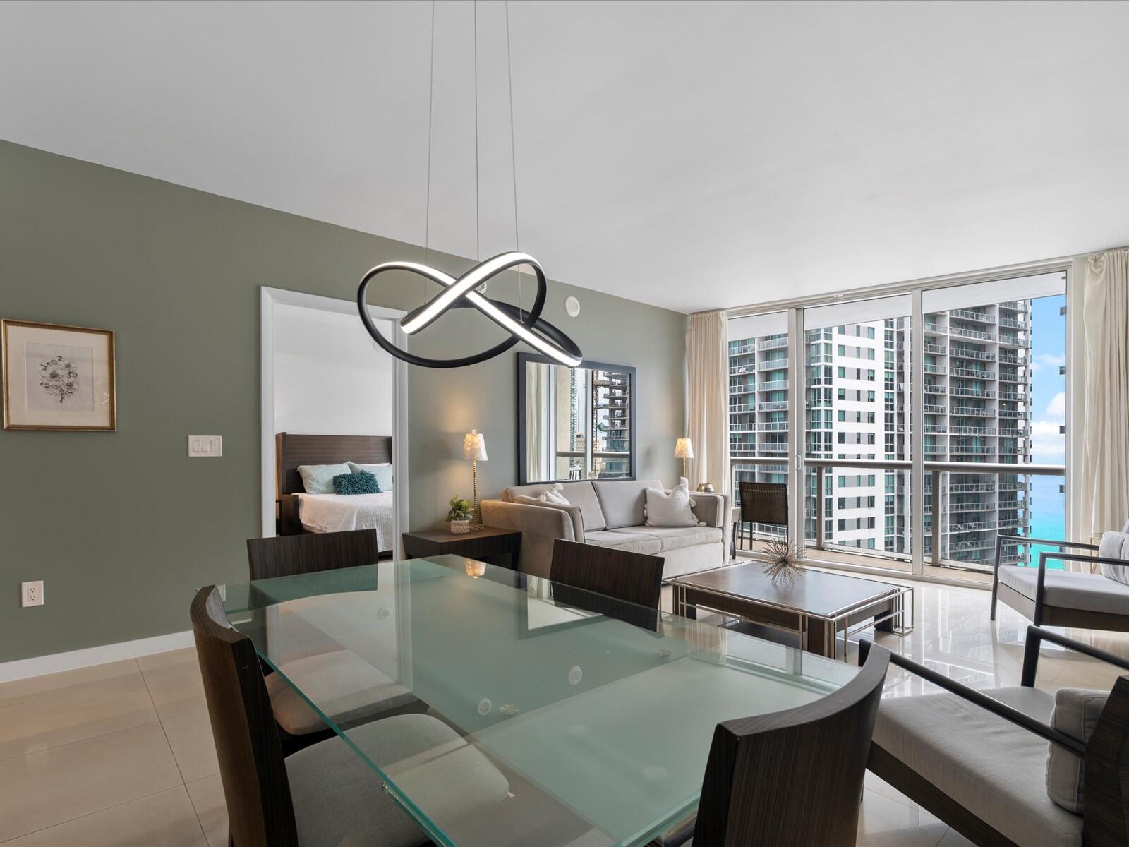 485 Brickell Avenue, Unit 2107 Miami, FL 33131 - Photo 2 of 18 a living room with furniture and a large window