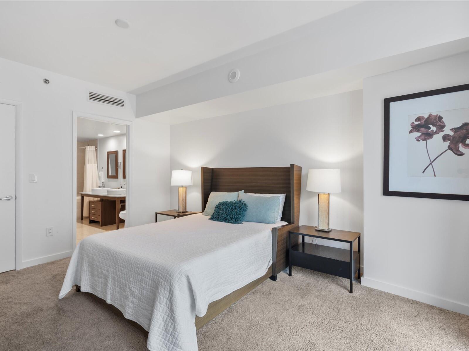 485 Brickell Avenue, Unit 2107 Miami, FL 33131 - Photo 8 of 18 a bedroom with a bed and a painting on the wall