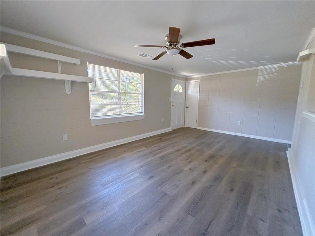 271 Rehoboth Road Griffin, GA 30223 - Photo 4 of 9 a view of an empty room with wooden floor and a window