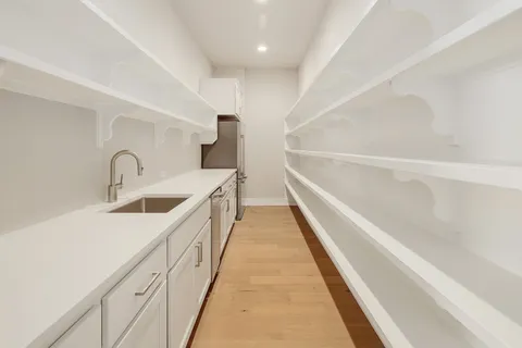 a hallway with washer and dryer