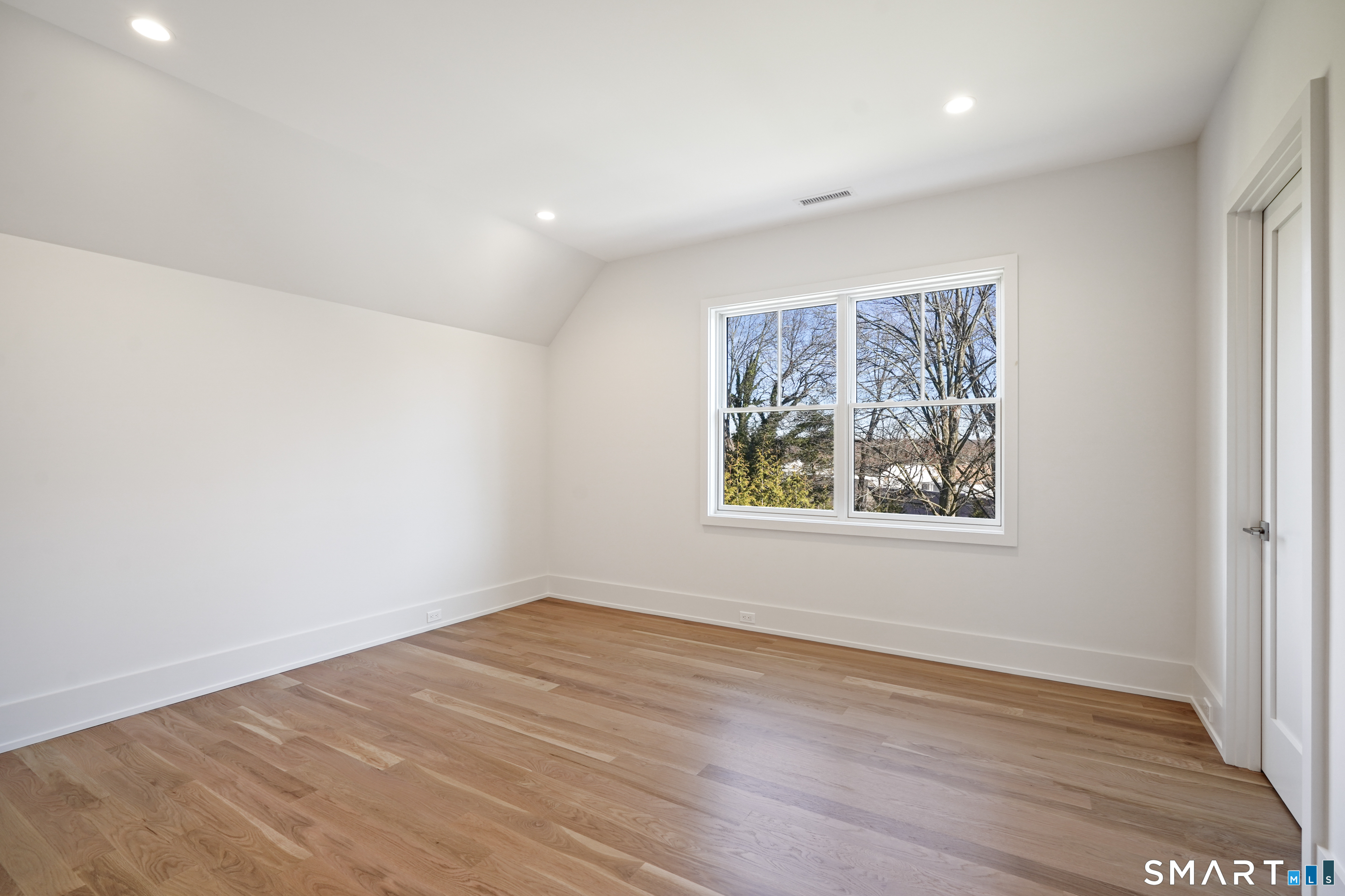 18 Woodhill Road Westport, CT 06880 - Photo 29 of 38 an empty room with wooden floor and window