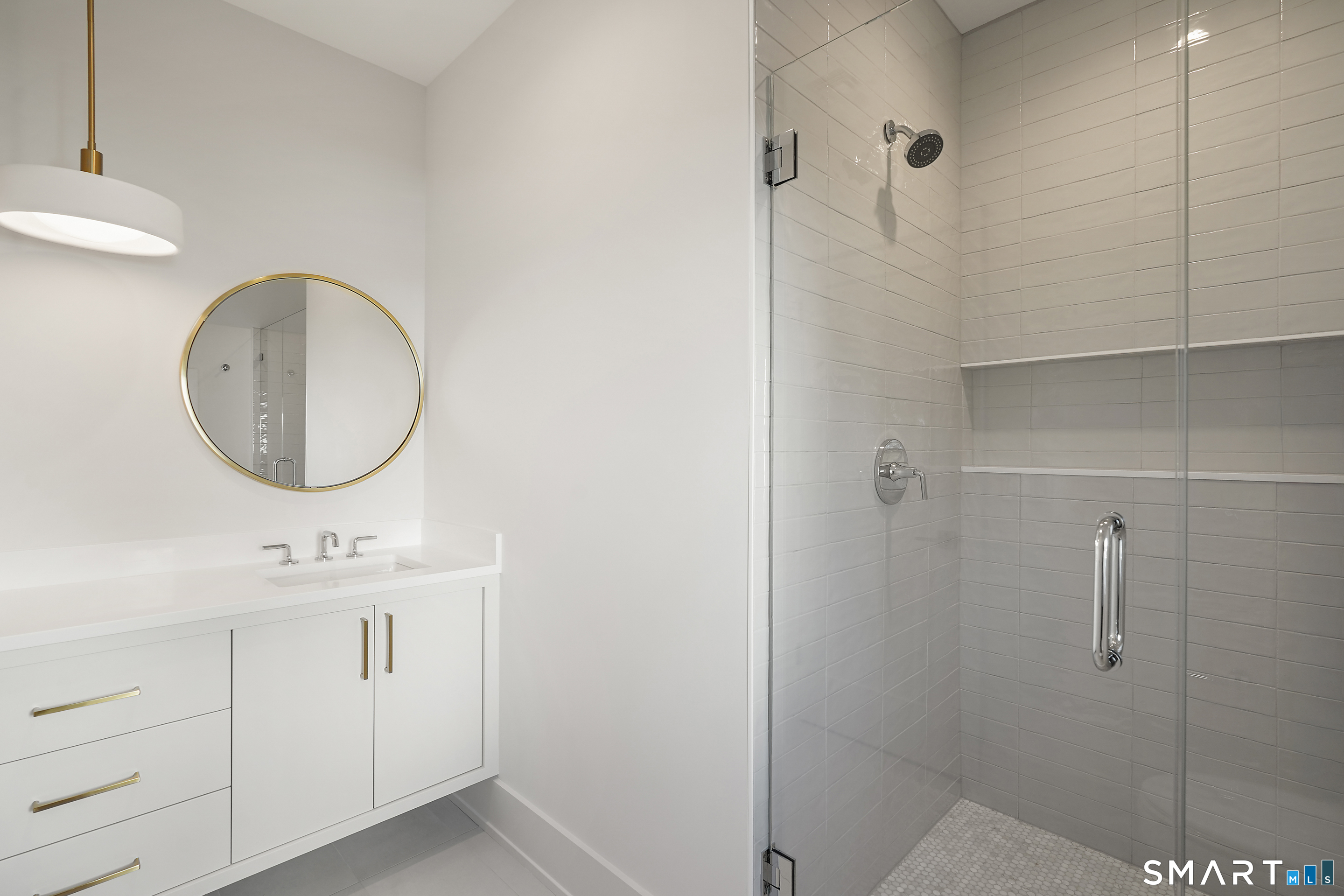 18 Woodhill Road Westport, CT 06880 - Photo 30 of 38 a bathroom with a sink mirror and vanity