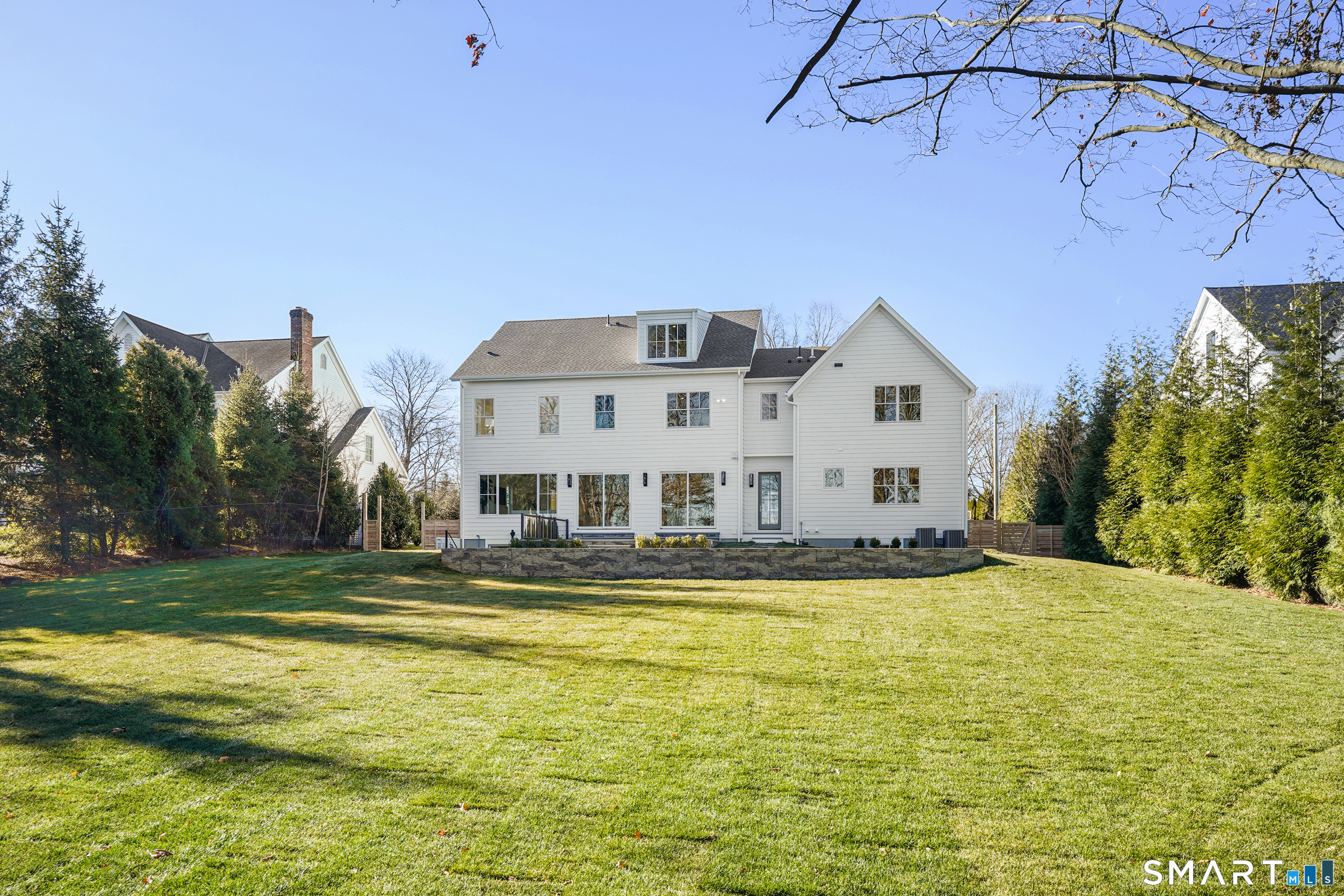 18 Woodhill Road Westport, CT 06880 - Photo 4 of 38 a view of swimming pool with outdoor seating and yard
