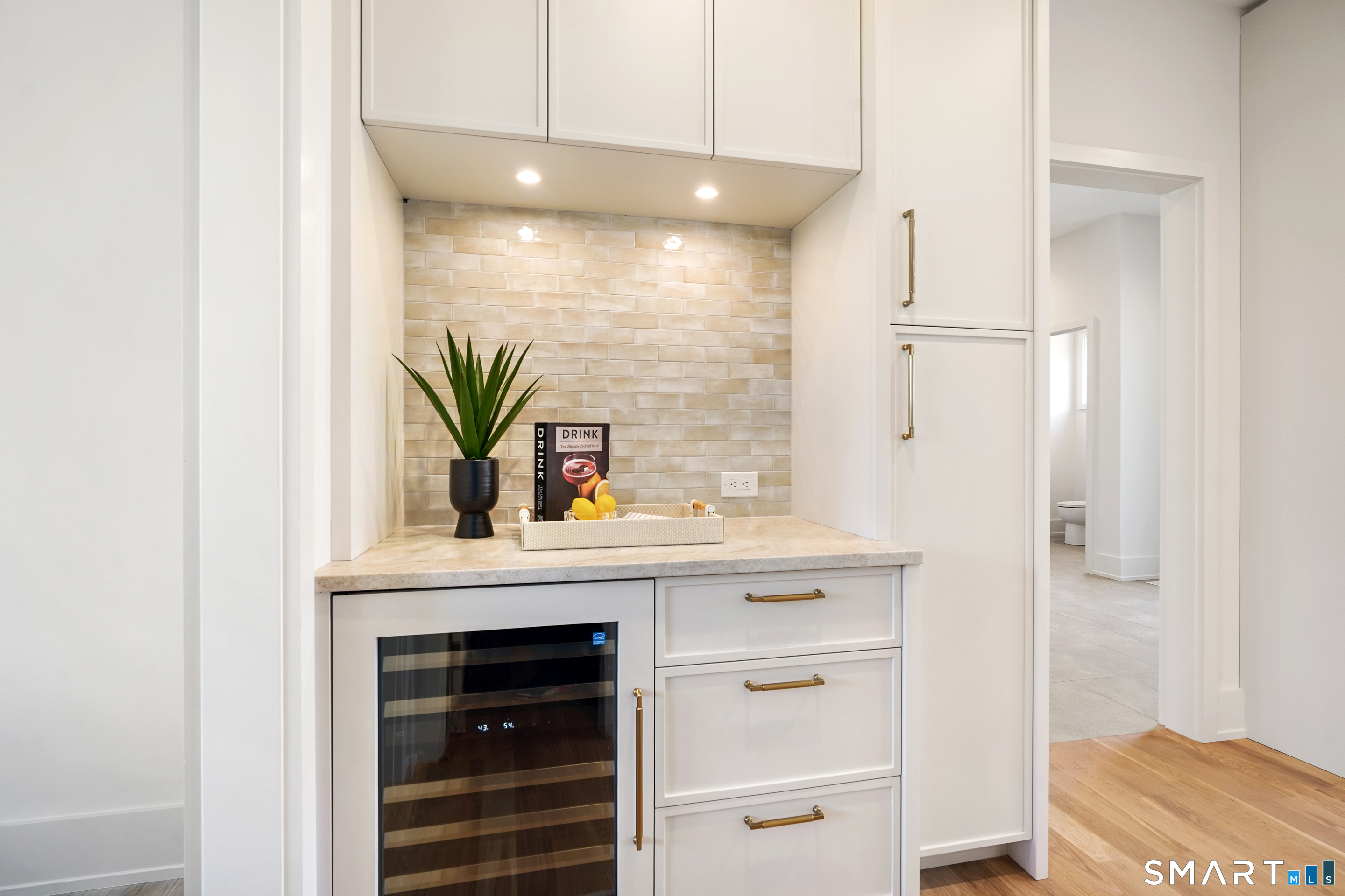 18 Woodhill Road Westport, CT 06880 - Photo 8 of 38 a bathroom with a sink a potted plant and a window