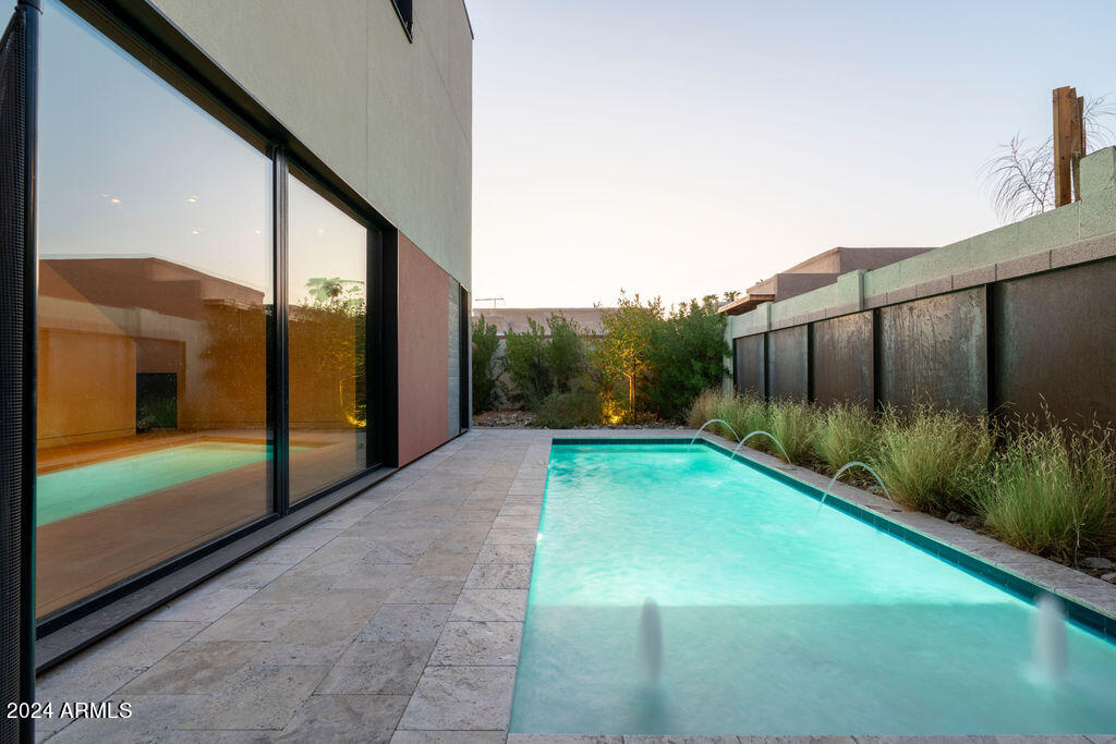 a view of backyard with patio