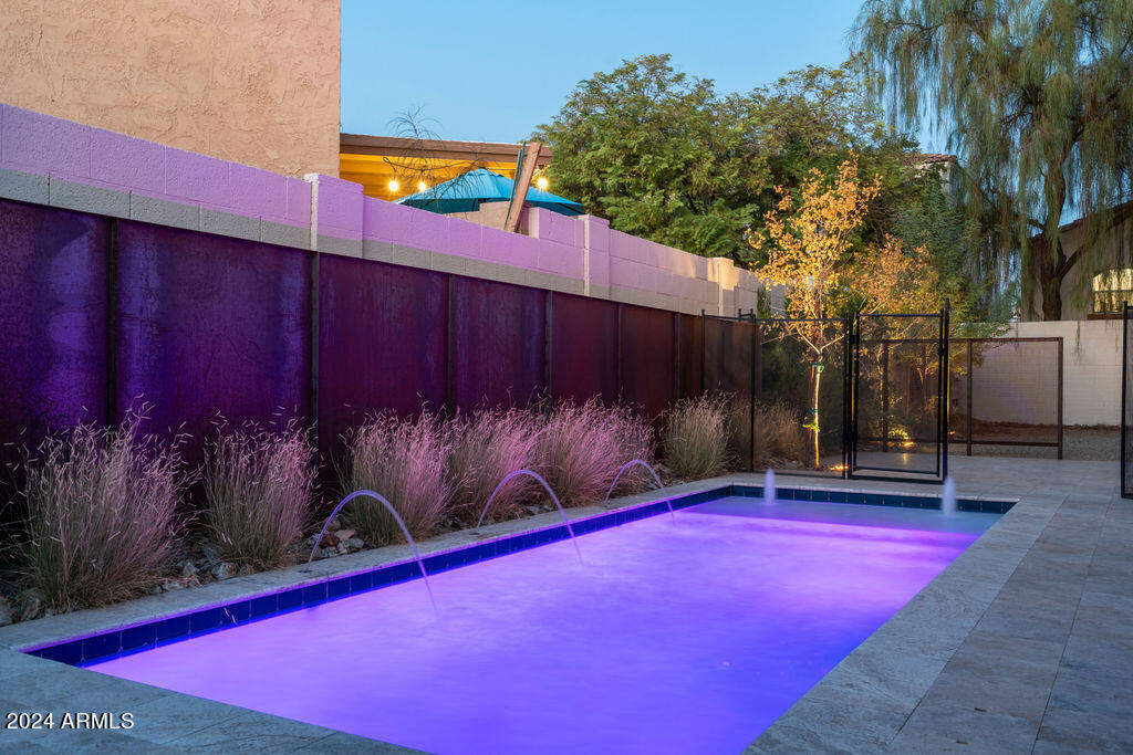 1740 East Ocotillo Road, Unit 4 Phoenix, AZ 85016 - Photo 16 of 20 a view of a tennis court with a patio