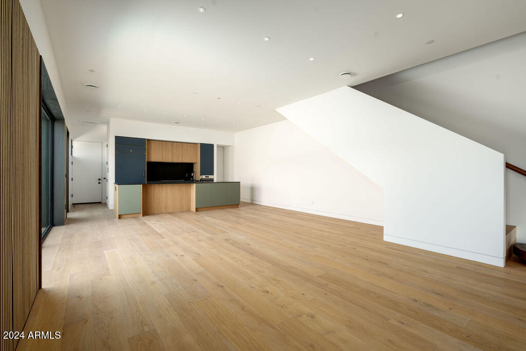 1740 East Ocotillo Road, Unit 4 Phoenix, AZ 85016 - Photo 6 of 20 a view of empty room with wooden floor
