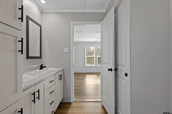 a bathroom with a sink and mirror